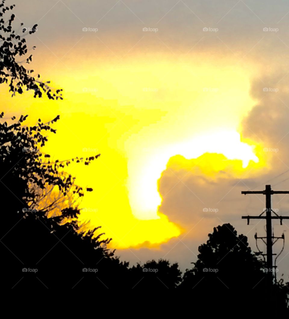 Golden Sunsetting in the Storm Clouds