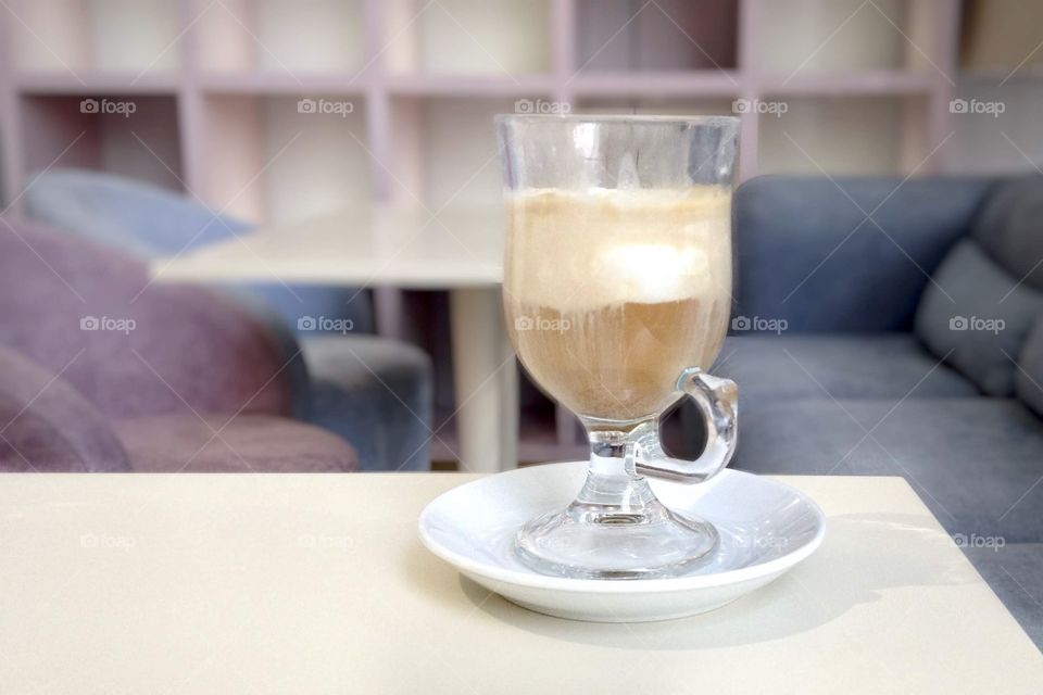 Ice latte in glass goblet, coffee in pastel colors cafe 