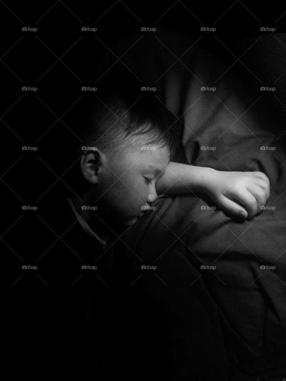 High angle view of a boy sleeping