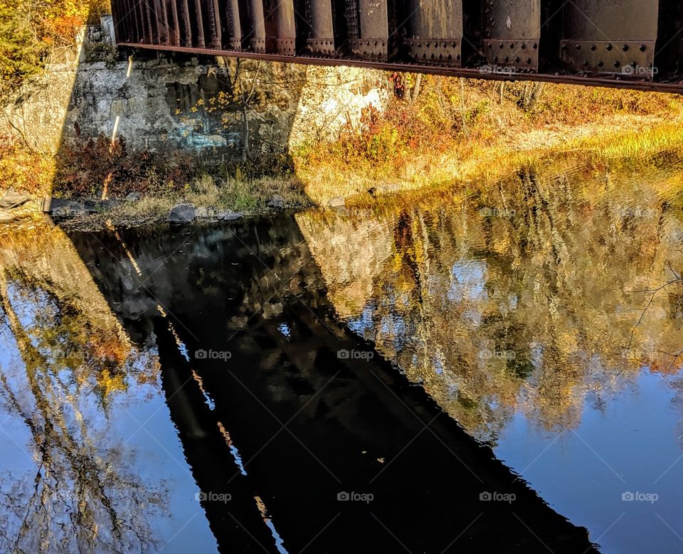bridge Shadow and fall tree reflections