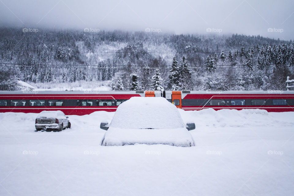 Car covered in snow in Norway 