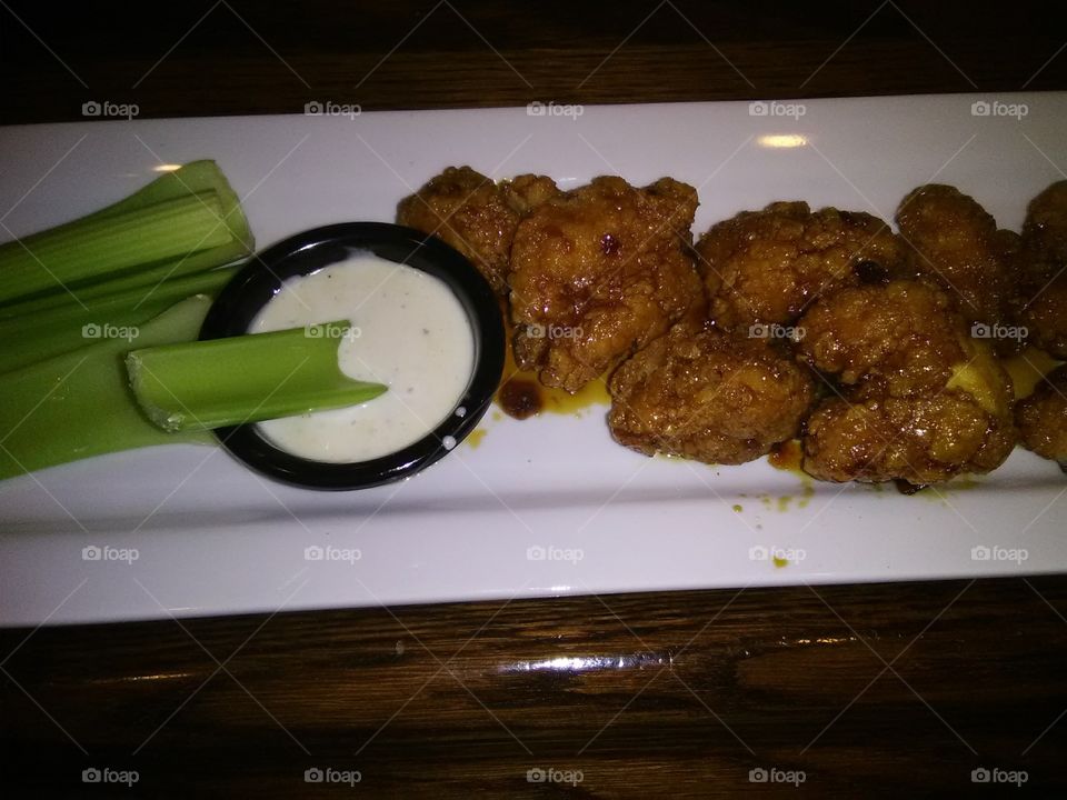 Jack Daniels wing's with celery sticks and Cool ranch dip on the side