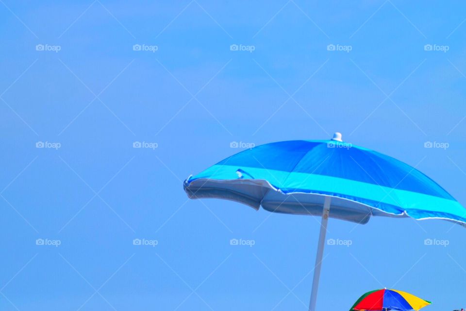 Bright umbrellas against the blue sky