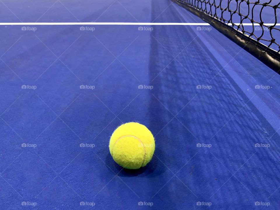 Yellow ball on blue background 