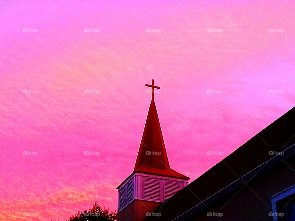 The heavens. Sunset behind the church