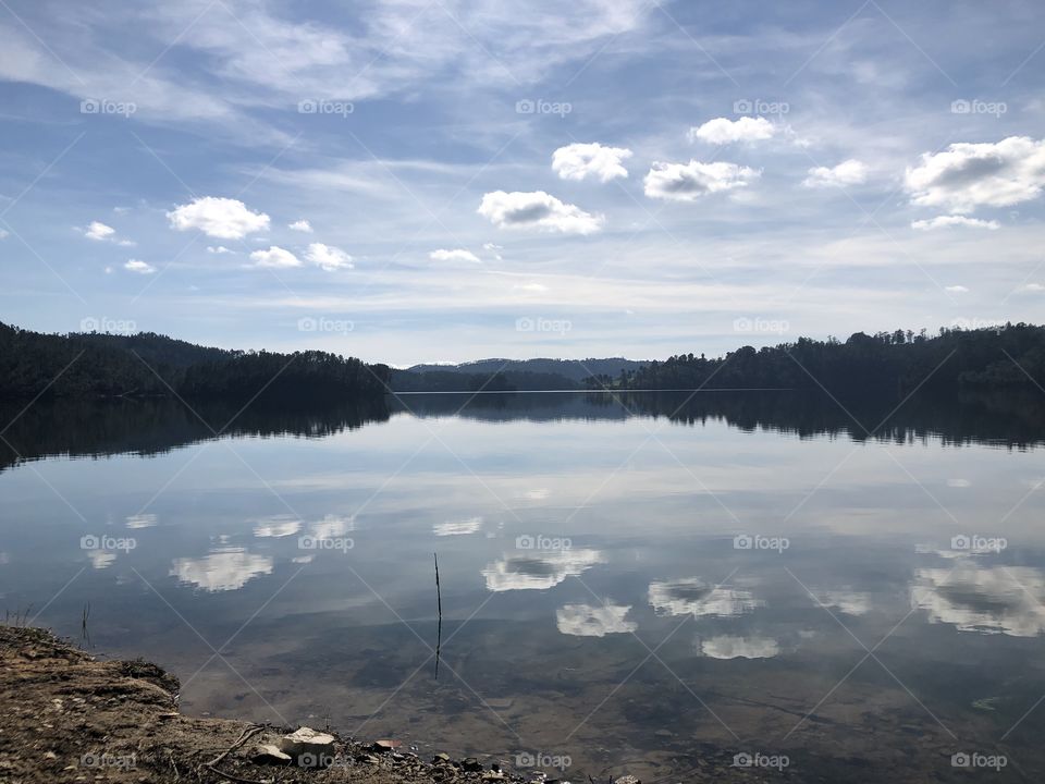 As above, so below; the light clouds and blue sky reflect into the calm waters of Rio Zêzere - no edits, #no filter, #true photos, #true nature