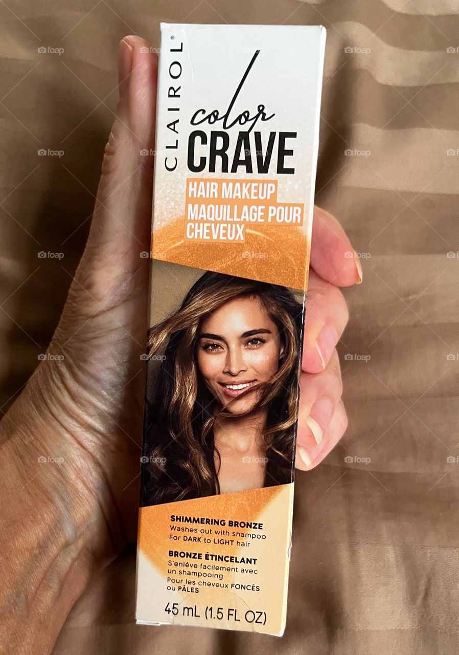 Hand holding Color Crave product.