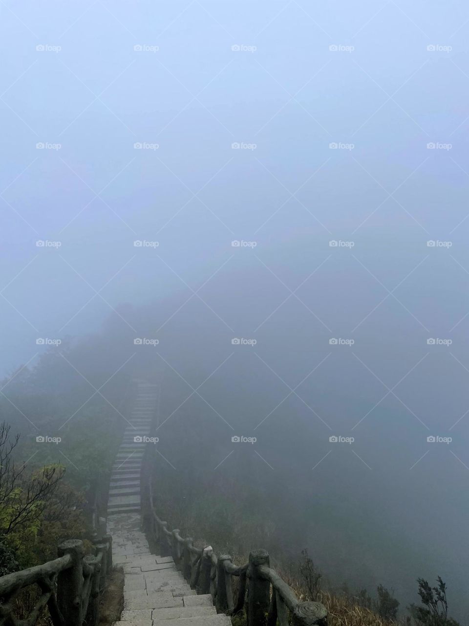 Surrounded by clouds and fog