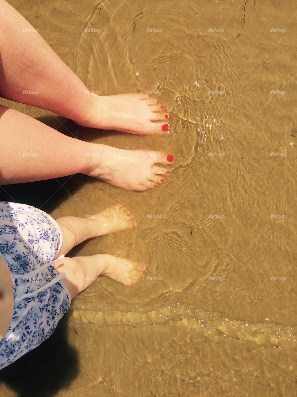 This was taken just before I emigrated from the UK to Canada. I spent the summer with my niece as much as possible and discovered she loved the beach and sea as much as I did. She also loves photography and was fascinated by this shot and my red toes peaking through!