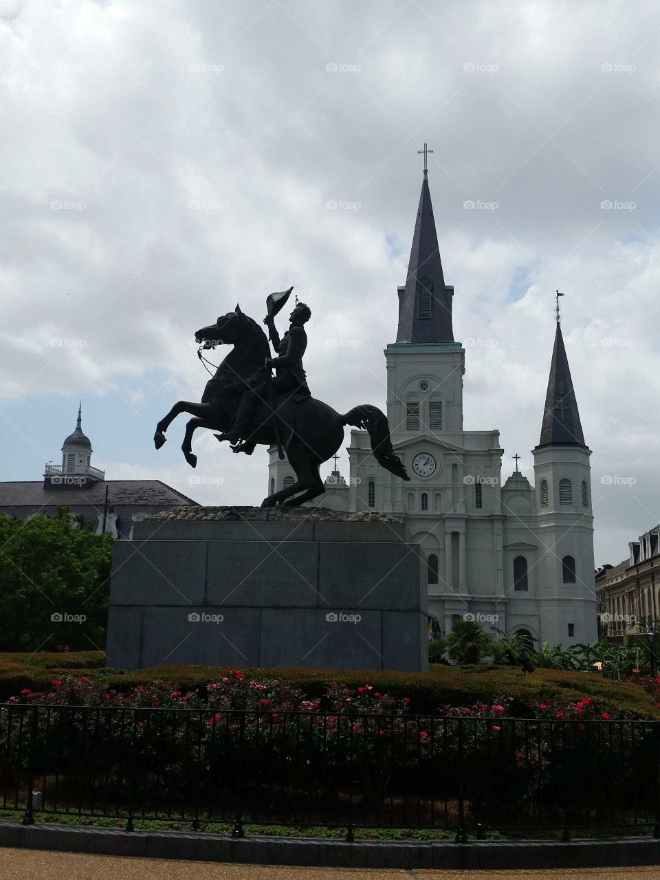 Rober E Lee, statue in foreground, since been removed.  Background is the St. Louis  Cathedral  at Jackson square,  New Orleans.
