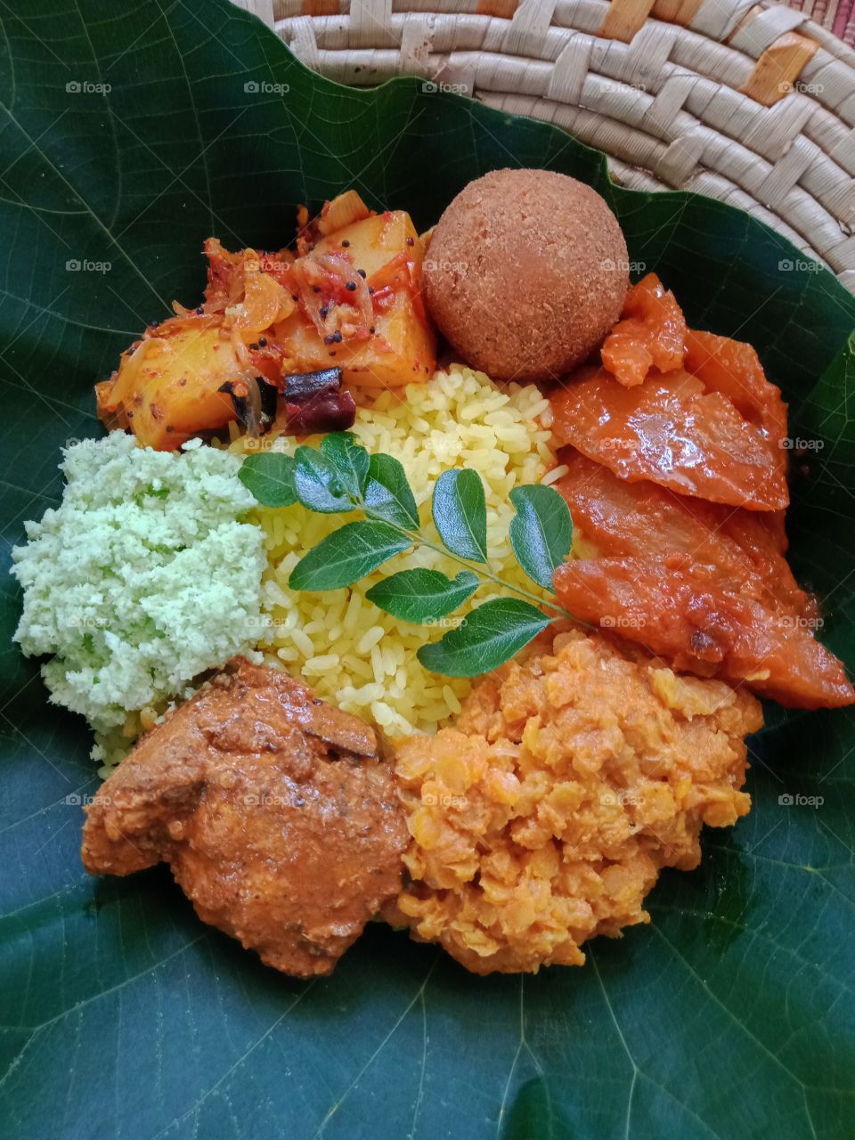 Sri Lankan special yellow rice with curries .