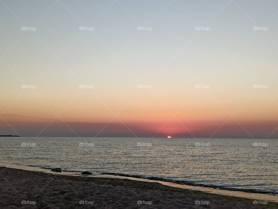 Sunrises. Sunsets. The sun. Sunlight. Sea.