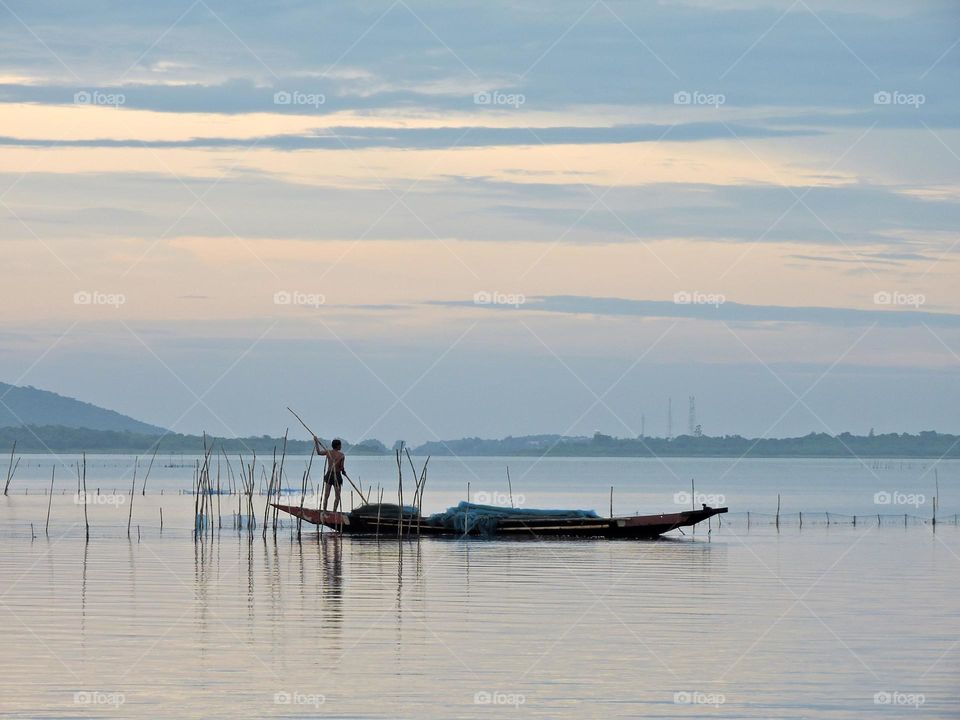 Fisherman in a lake