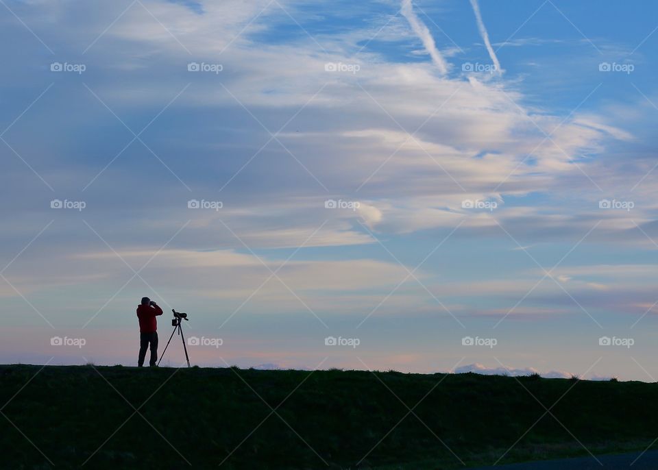 Photographer at sunset