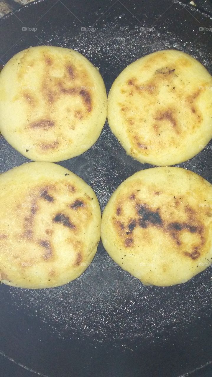 I making Arepas for the dinner. Arepas in the pan. Cooked and Crispy!