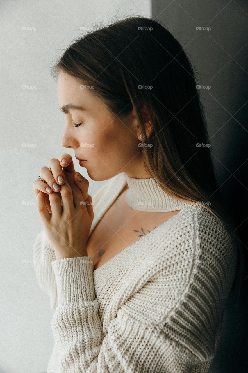 Girl close eyes and pray