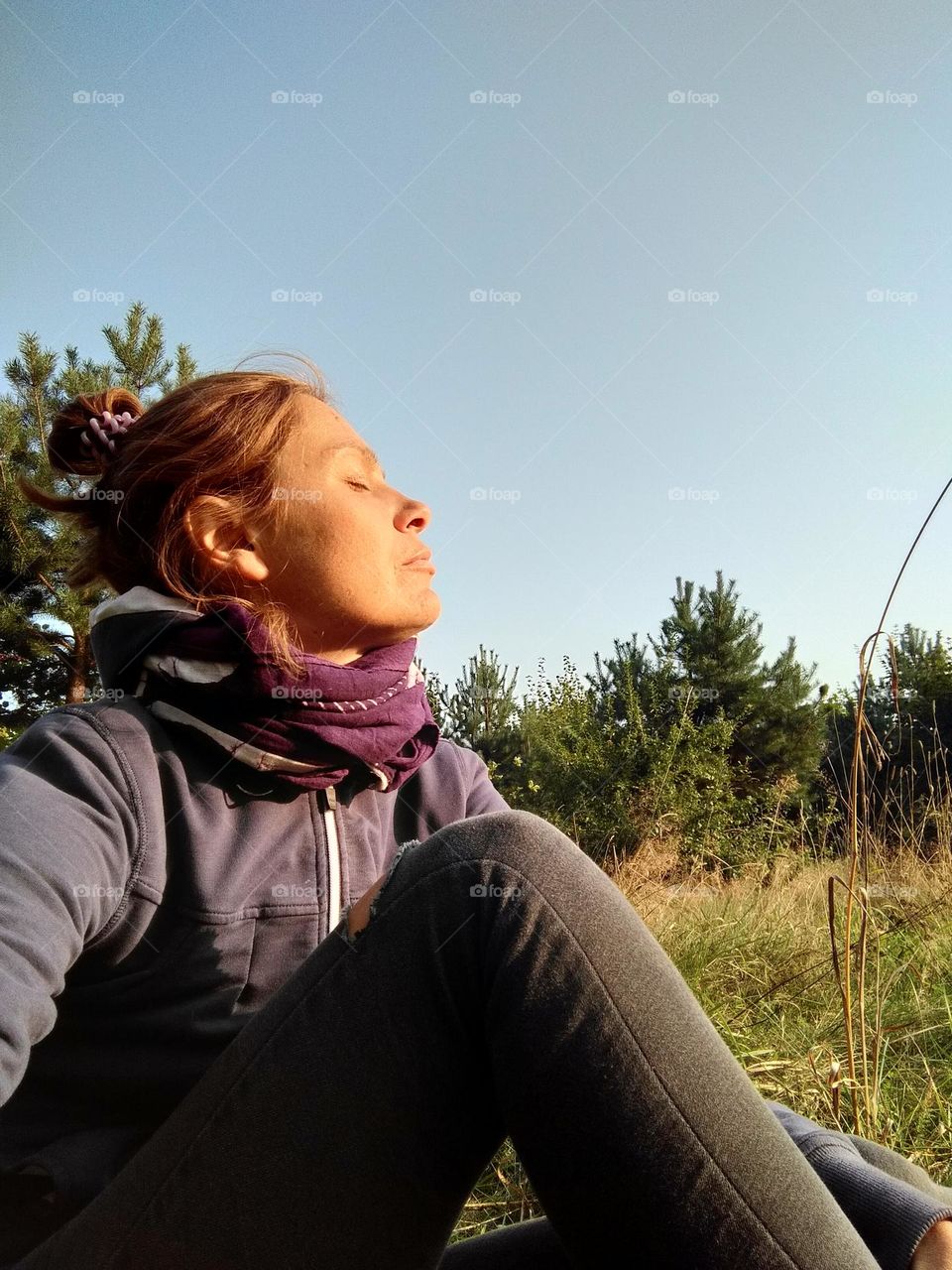 woman sunbathing profile portrait