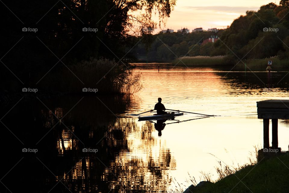 Canoeist in the sunset . Canoeist in the sunset 