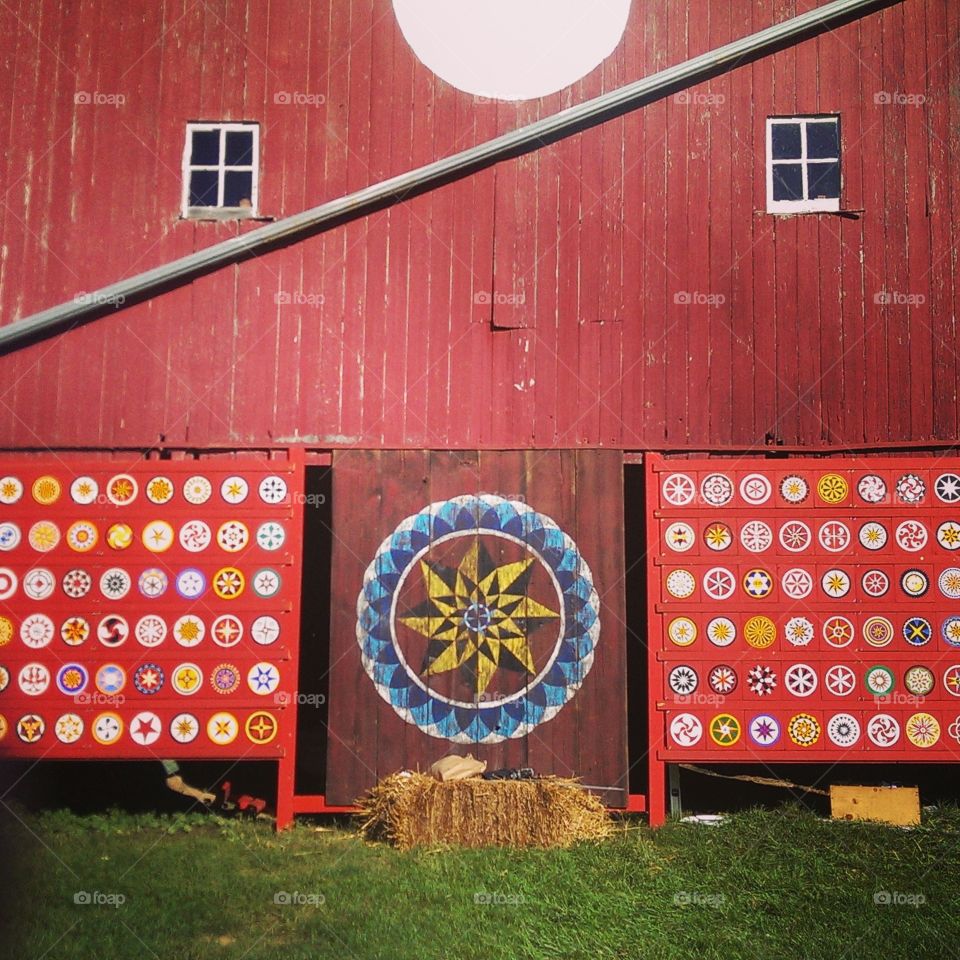 Red barn with hex signs 