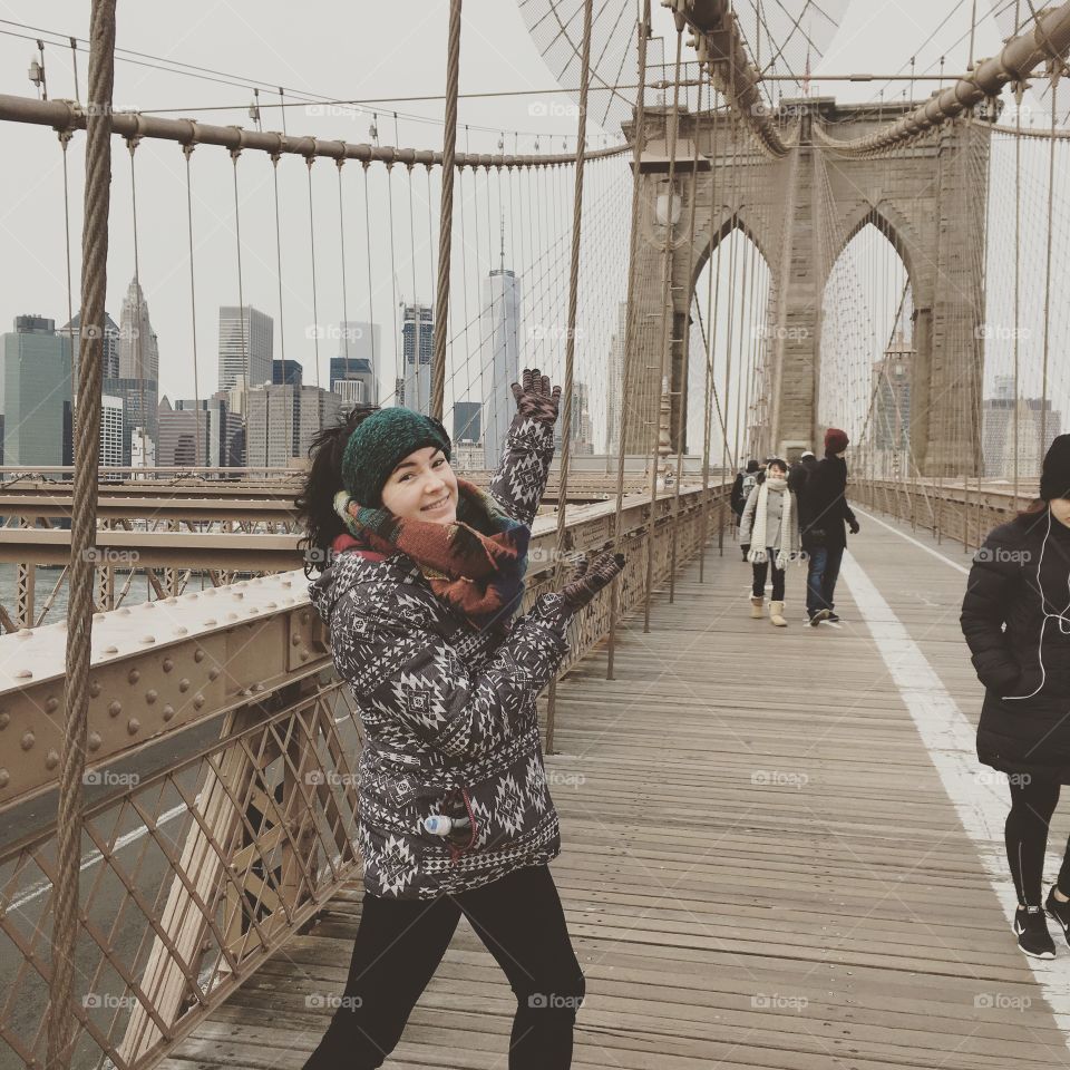 Crossing the Brooklyn Bridge, NYC.