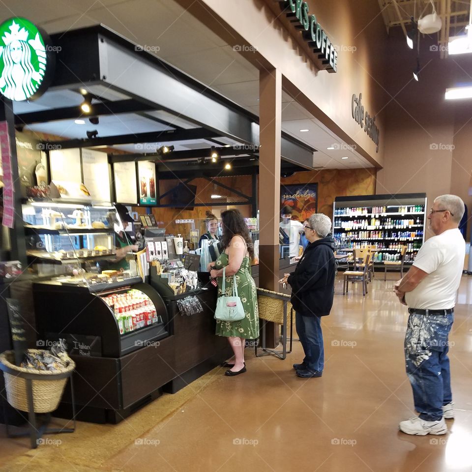 people in line for Starbucks coffee