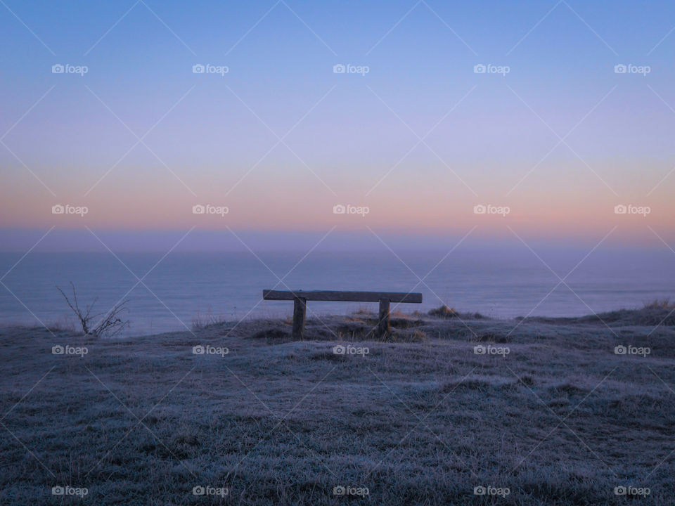 A bench on the edge of  dawn