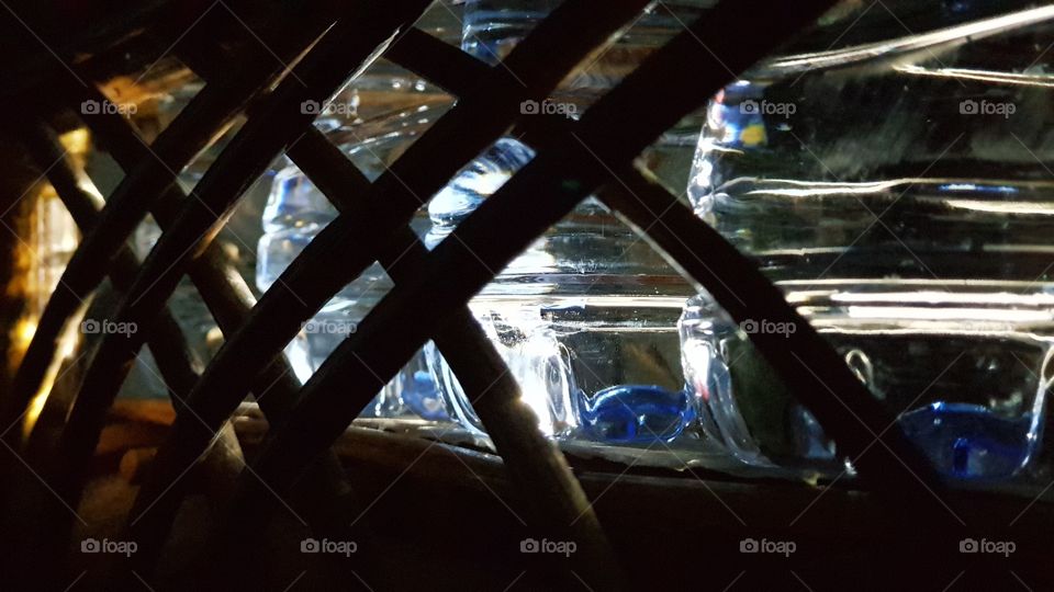 some bottles of water mineral on rattan shelf in a closer look point of view..