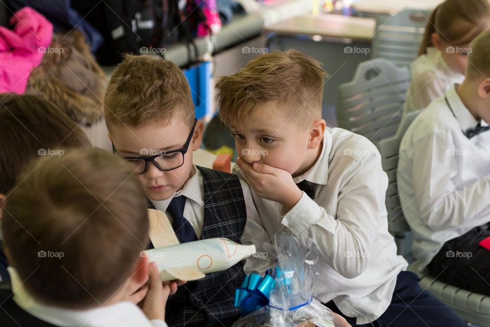 Children schoolchildren on a holiday, bright emotions surprise