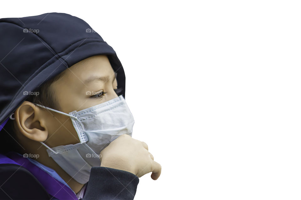 isolated Asean Boys wear a mask to prevent dust on a white background with clipping path.