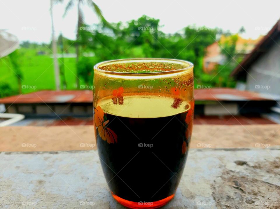 a cup of hot coffee in the rainy season