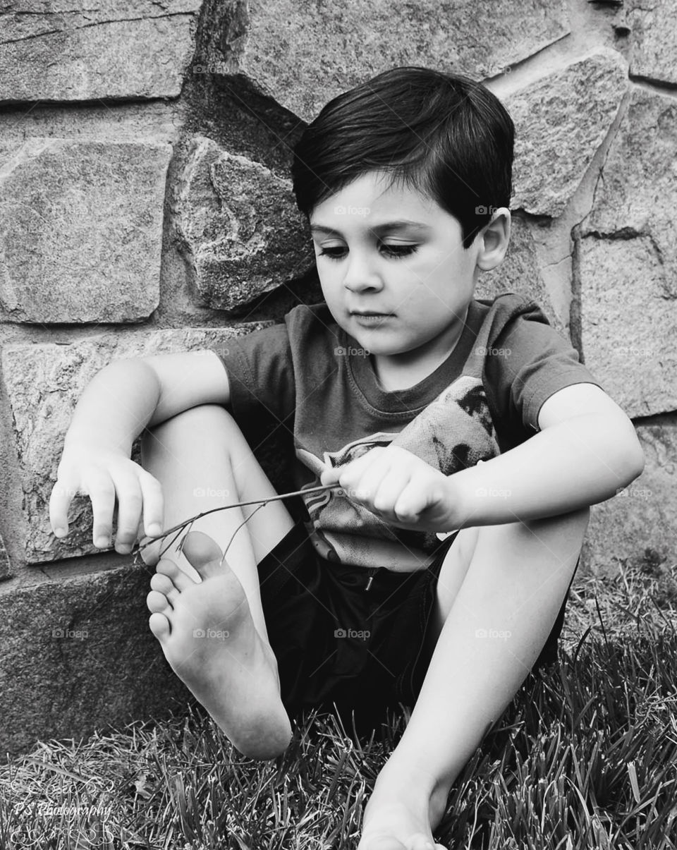 Boy playing with twig