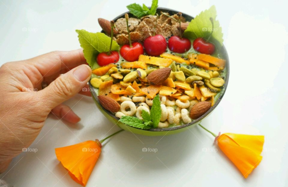 Fresh Fruit Smoothie Bowl - cheery,   mango, banana, cereals,  seeds and nuts