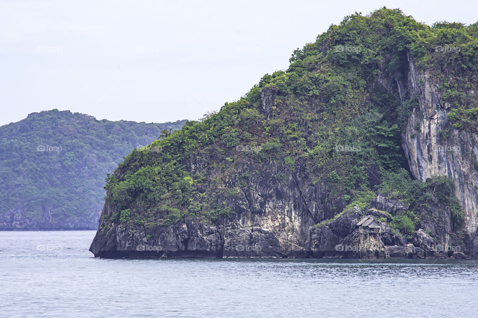 Wooden houses built on rocks in the koh Maphrao at Chumphon in Thailand.