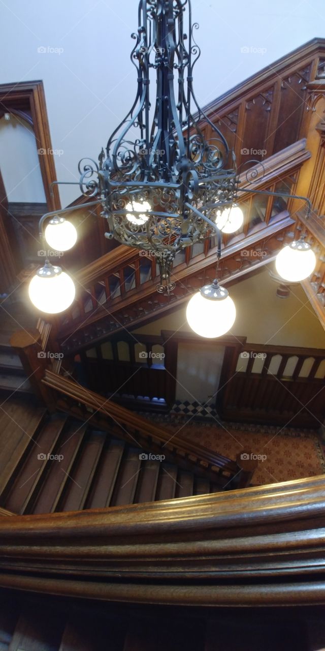 lights over grand staircase of country house