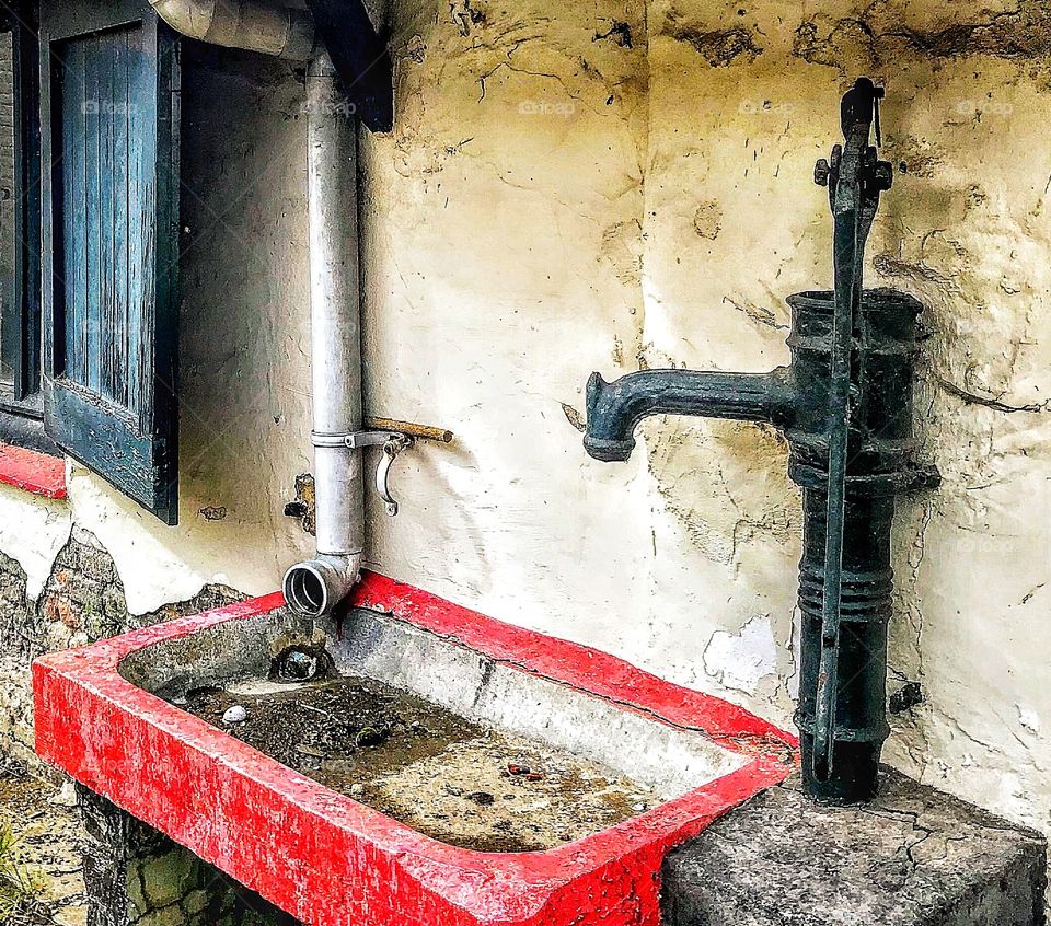 Outdoor wash station at abandoned farmhouse