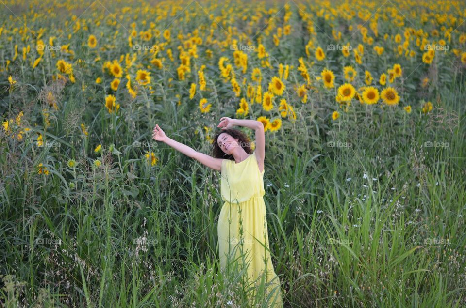 Beautiful Young Woman Dancing Outside in Nature