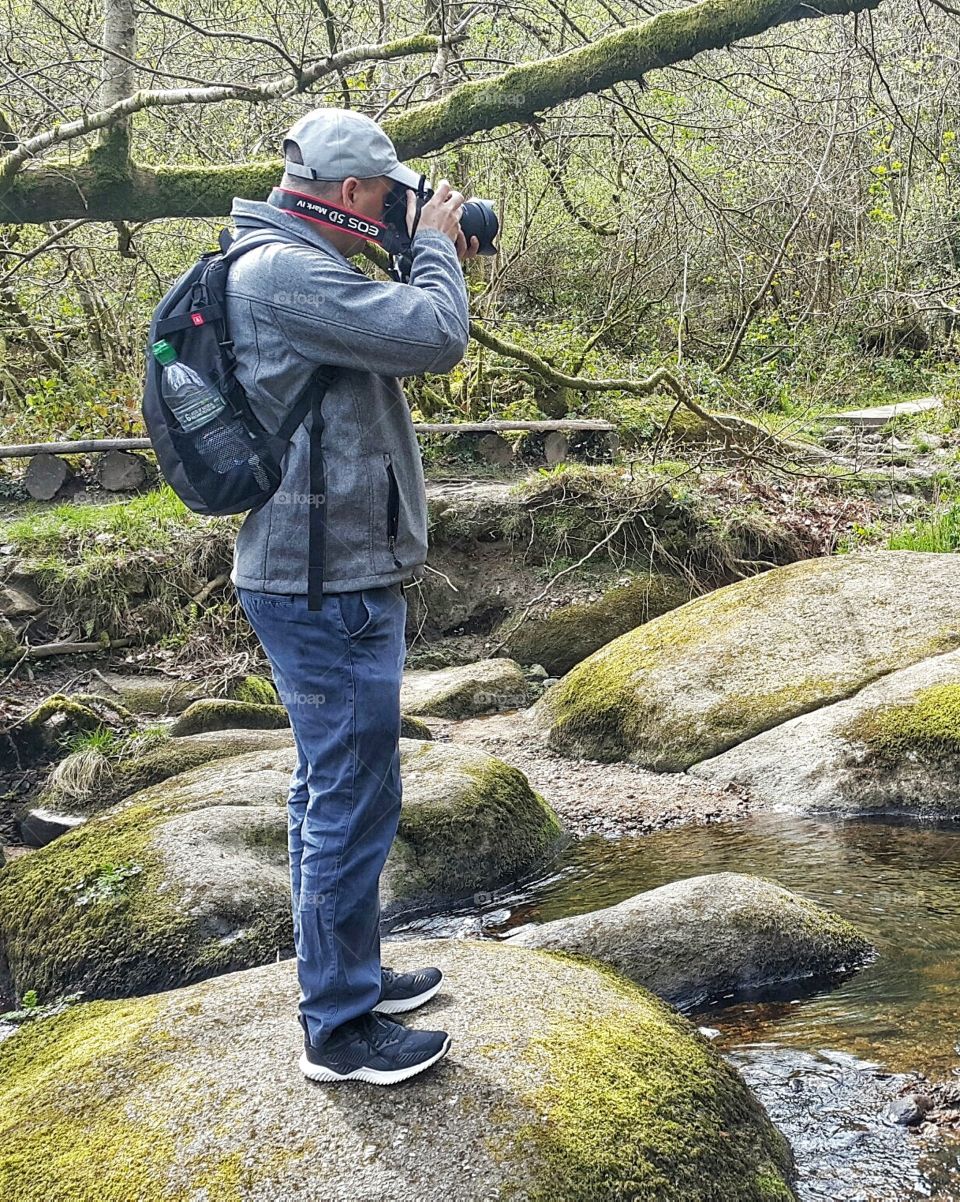 Professional photographer in the forest