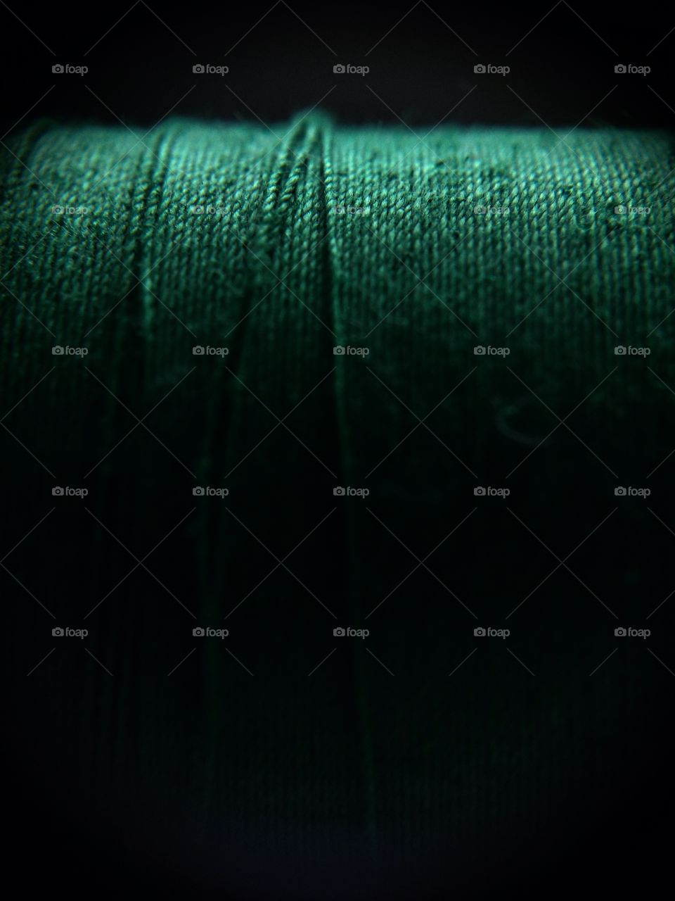 Closeup of green thread