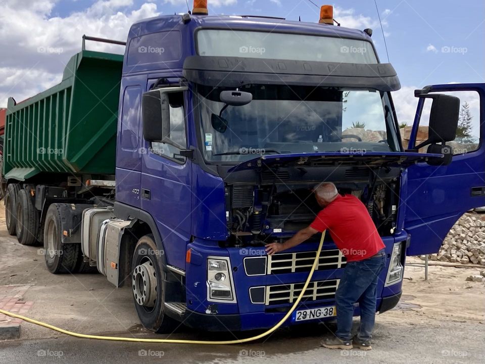 Under the hood of a blue truck 