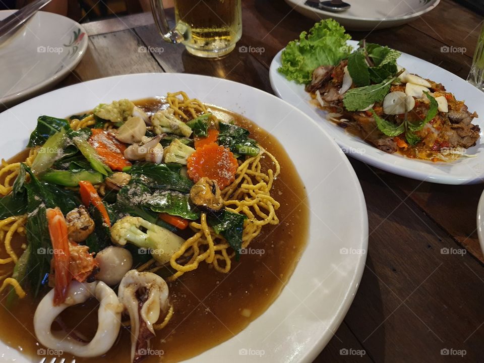 fried noodle with seafood ang vegetable in soup