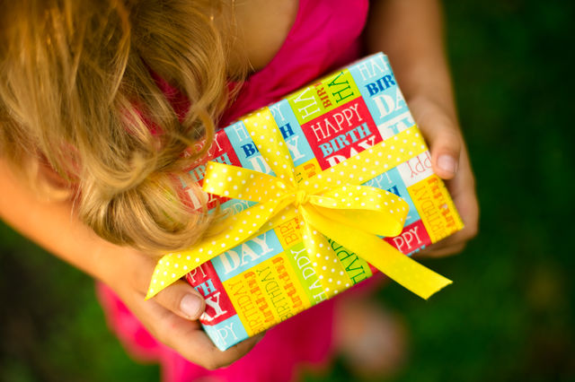 Little girl with present box . Happy birthday 