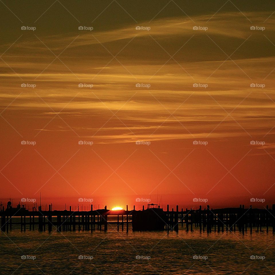 The sky erupted in spectacular golden hues of pinks and oranges moments before the sun sunk below the horizon in the Ocean Beach giving the fabulous hillside residents a fabulous and unforgettable sunset.