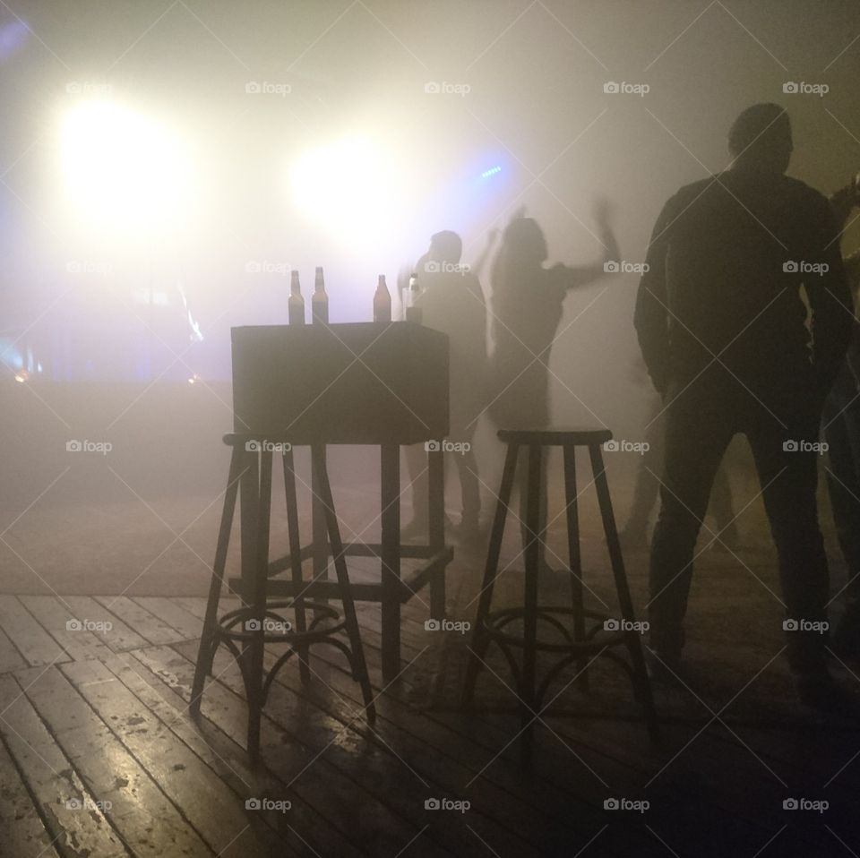 nightclub scene with silhouettes