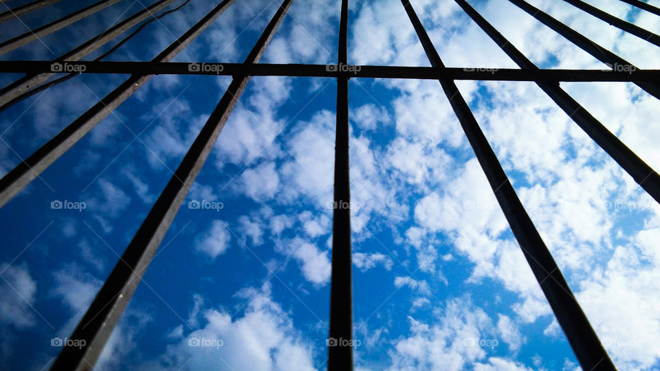 cloud and sky through silhouette window frame
