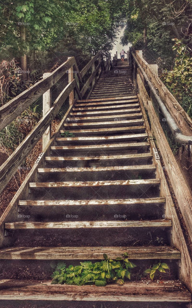 Looking Up. Man at the Top of the Stairs