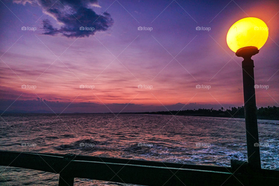 Sunset on a pier on the beaches of the Caribbean