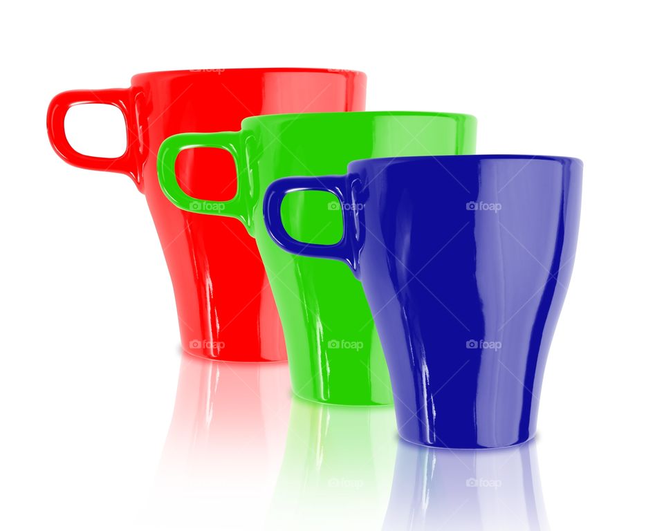 Red green blue coffee mugs isolated on white