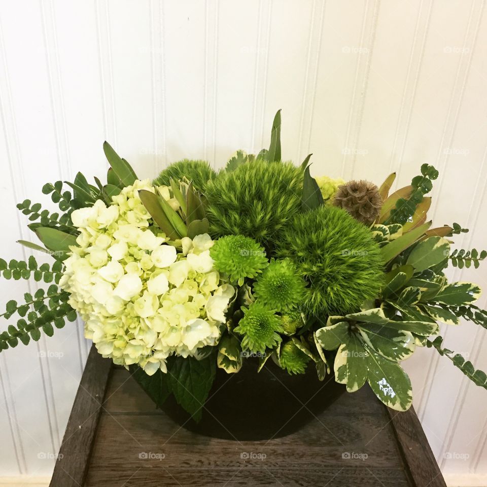 Green floral arrangement full of texture