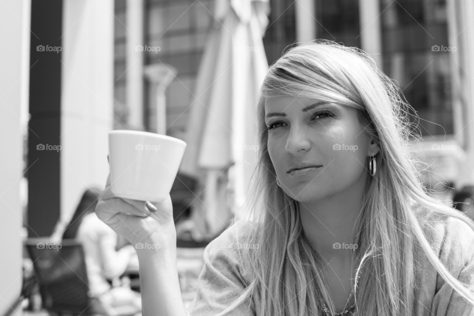 Woman holding coffee cup