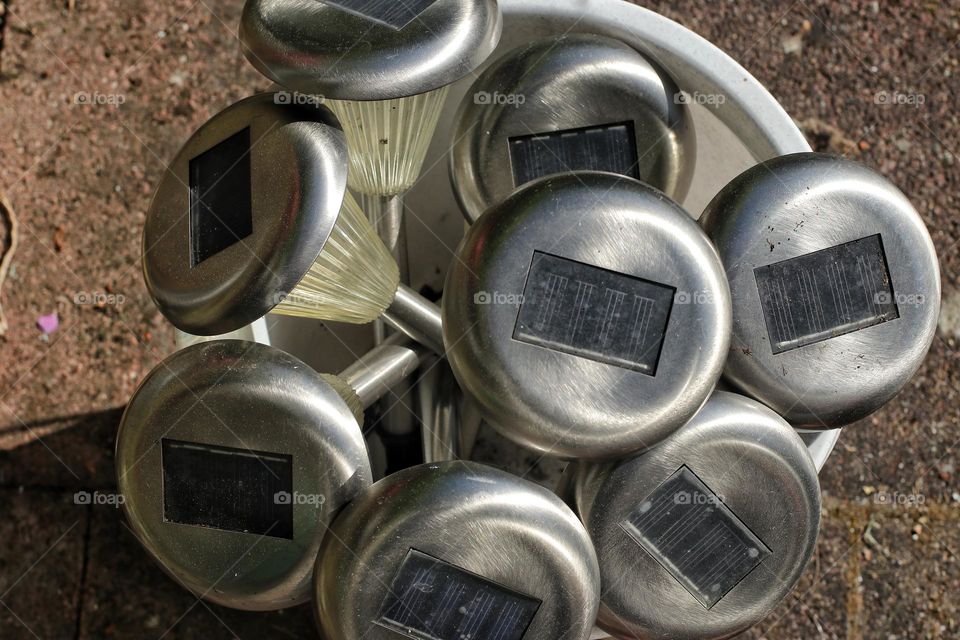 Lots of solar garden lights in a bucket